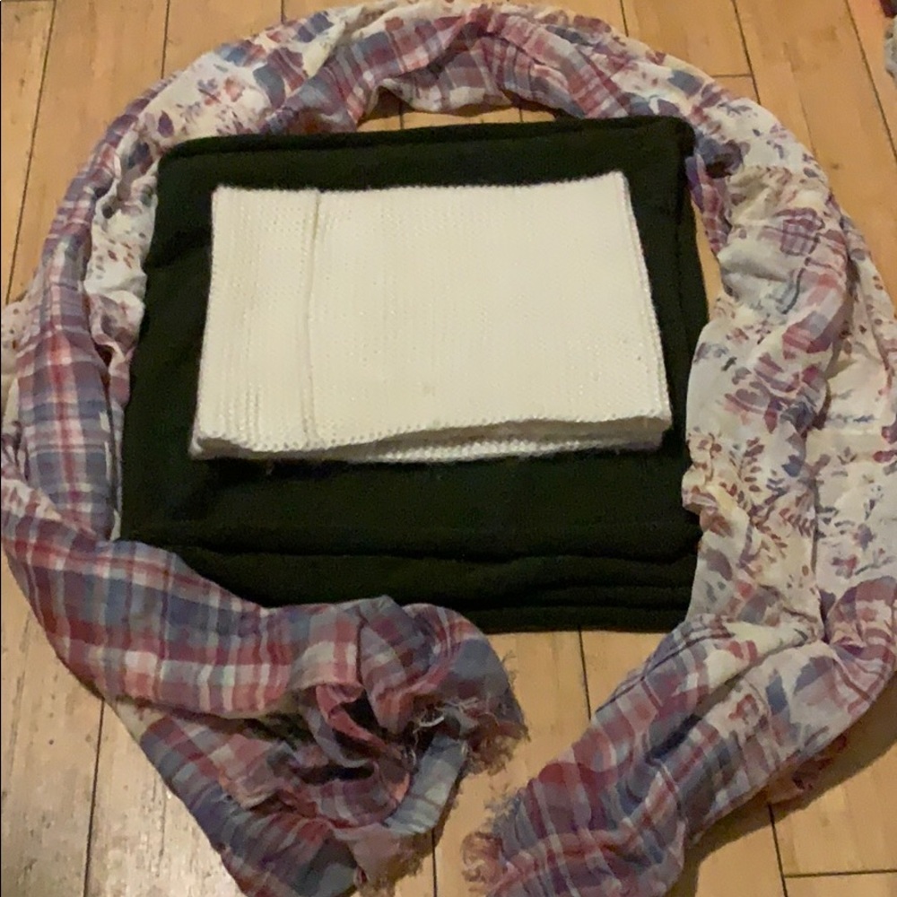 Three scarfs, two knitted, one open.